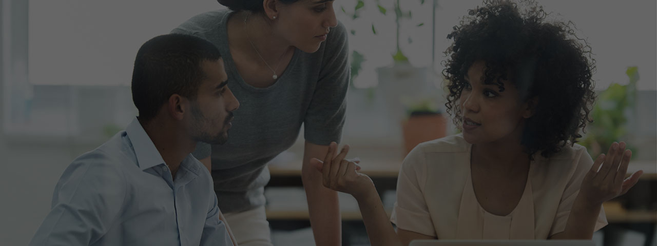 Banner - Three coworkers having a discussion