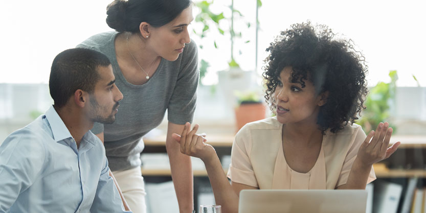 Thumbnail - Three coworkers having a discussion