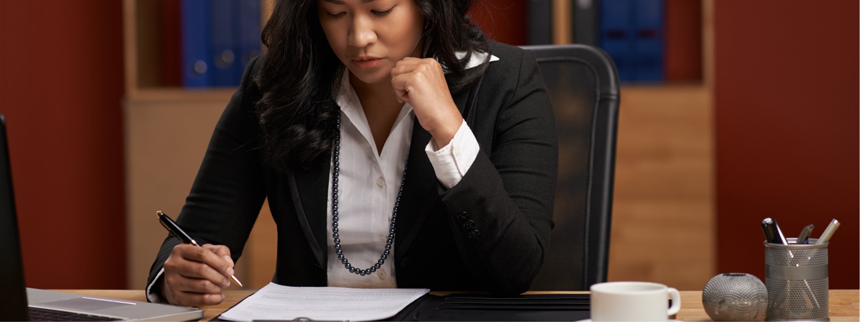 woman reviewing executive compensation disclosures