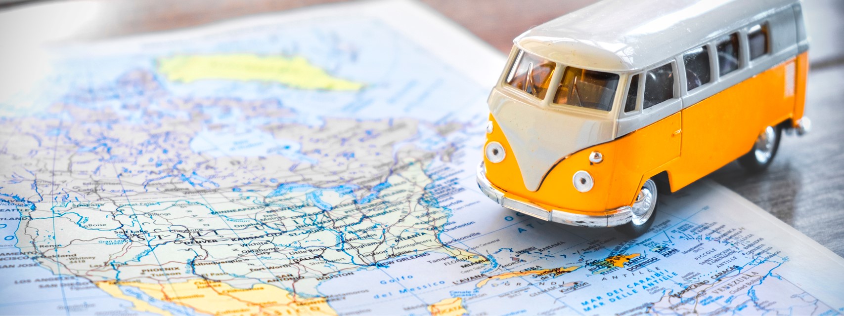 toy VW van next to map of the United States