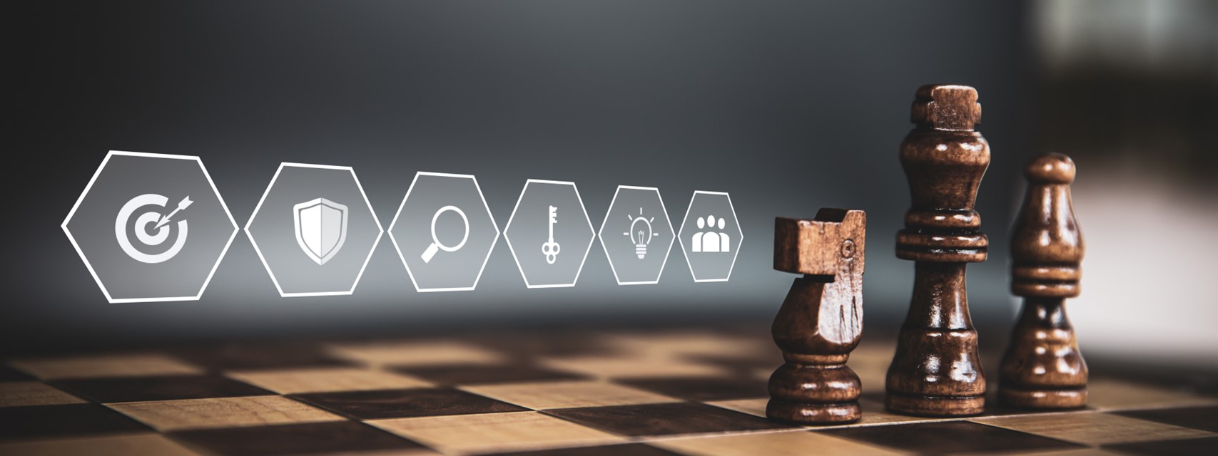Chess pieces with icons representing concepts of winning and employees