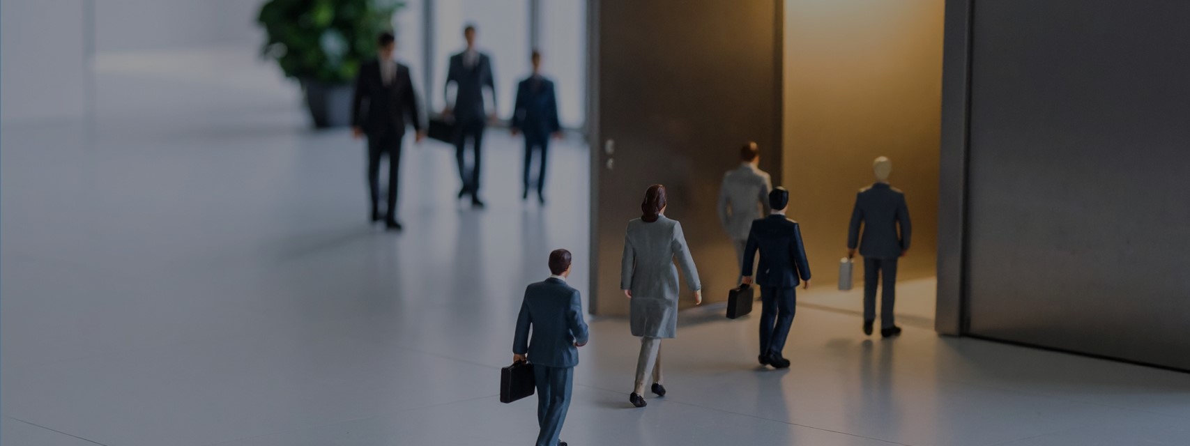 Visual metaphor for termination of employment showing employee figures leaving a building through a door marked exit