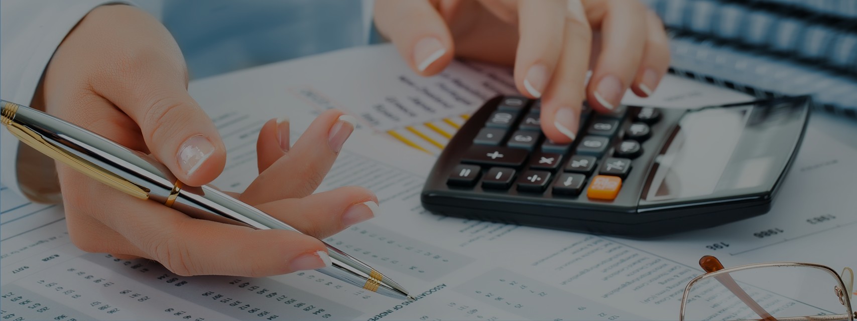 Close-up Pen Calculator On Financial Report - Accounting for ISOs