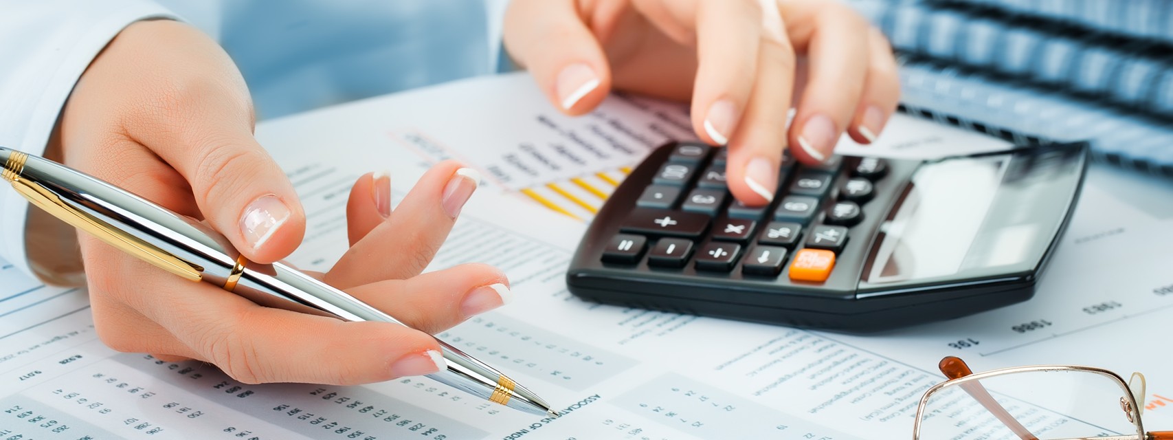 Close-up Pen Calculator On Financial Report - Accounting for ISOs