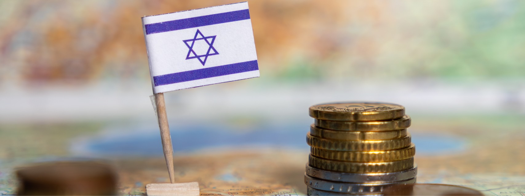 Israel flag with stack of coins