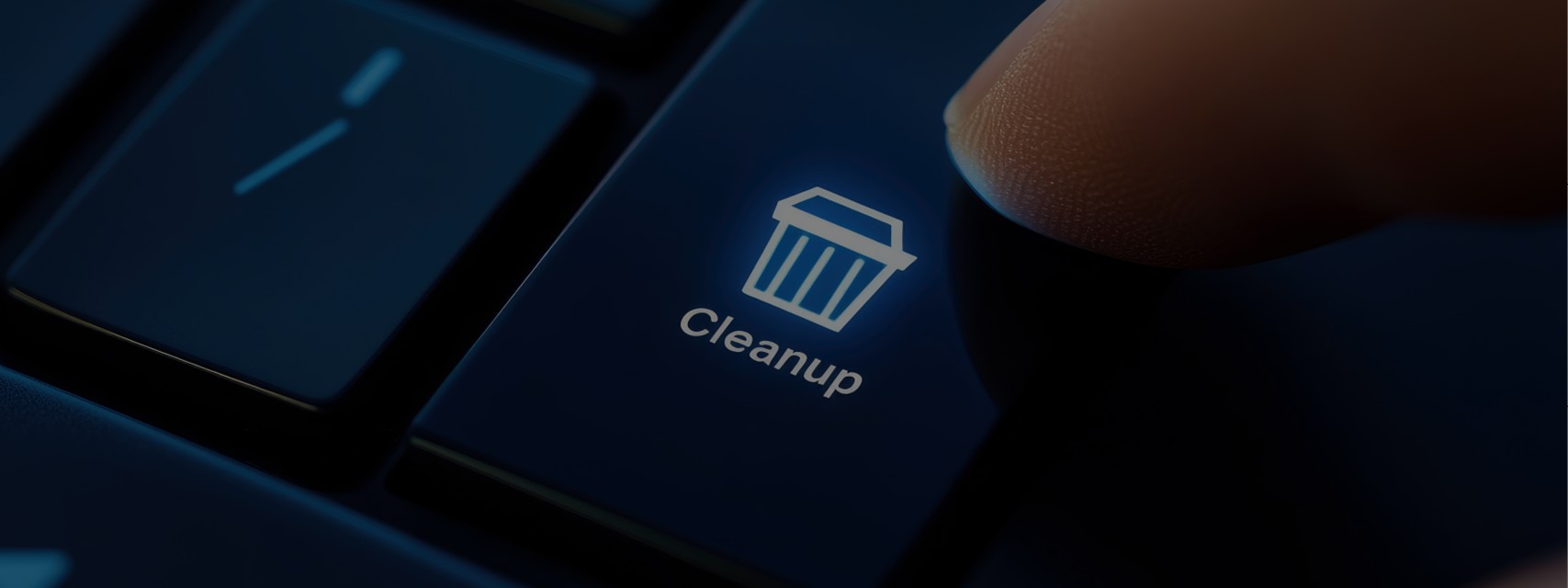 Person pressing "clean-up" button on computer keyboard