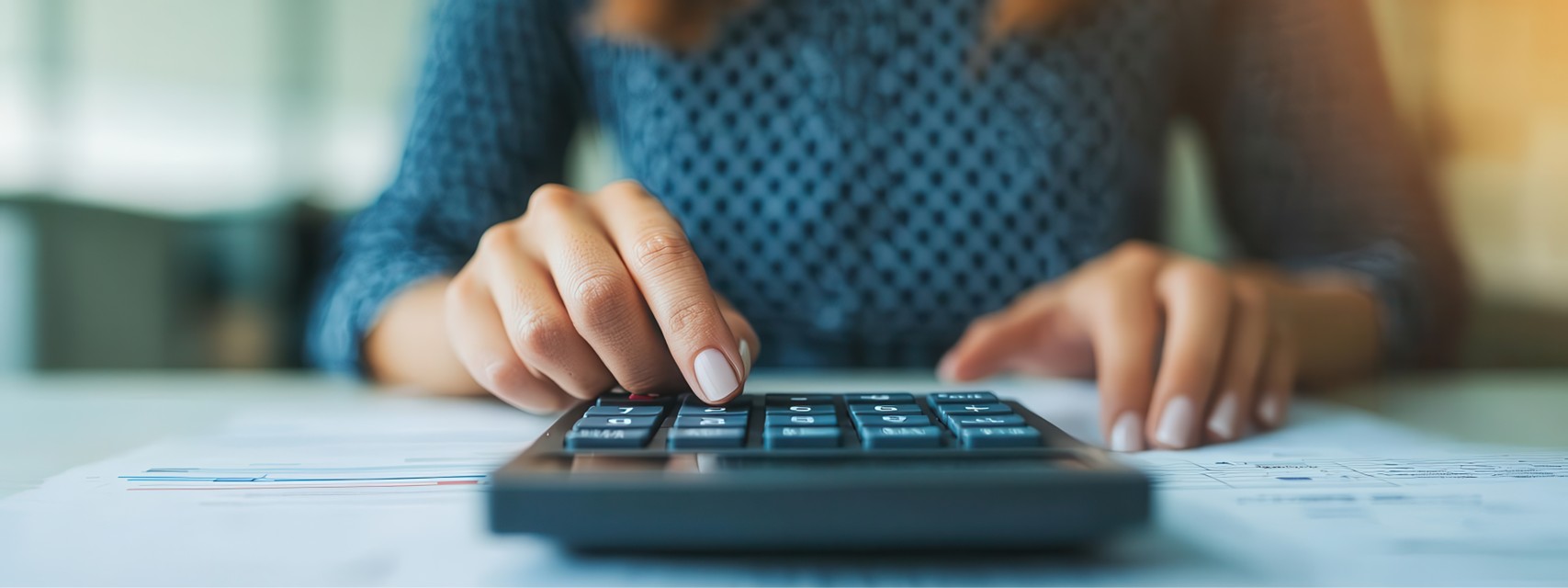 Stock plan administrator using a calculator to estimate the $25K limit