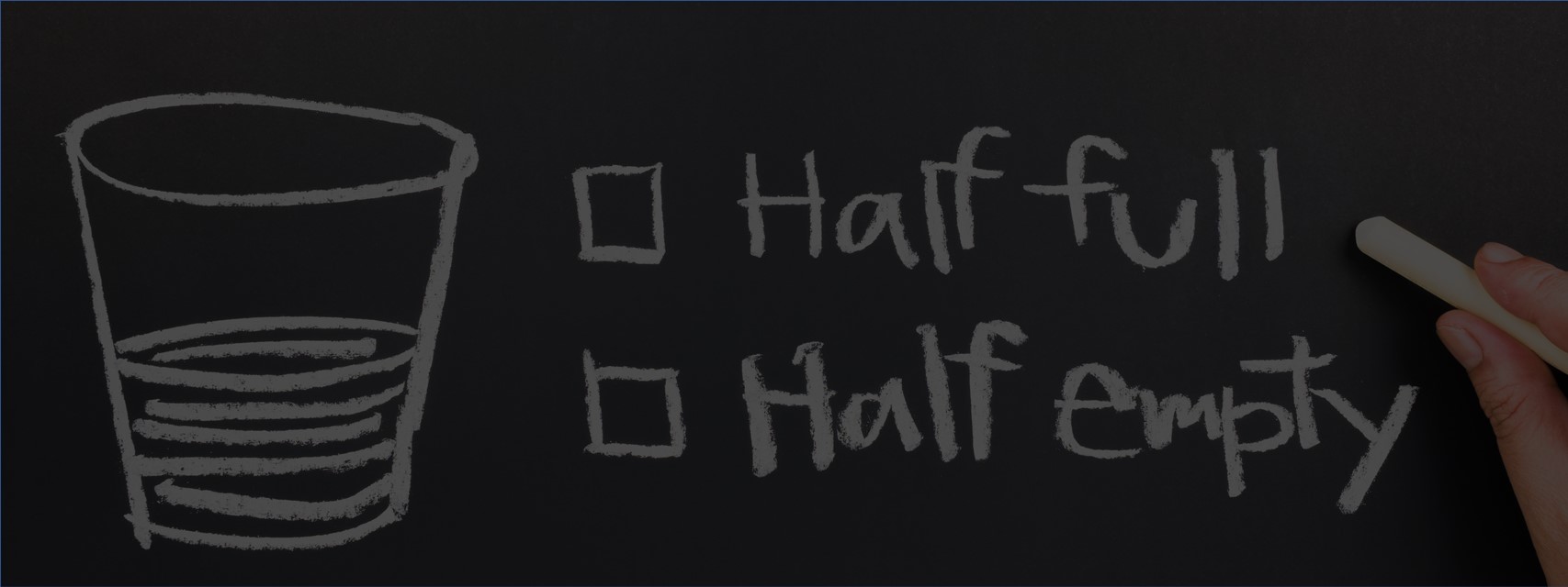 chalkboard drawing of glass half full