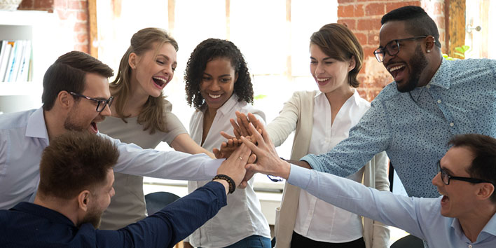 Coworkers celebrating teamwork