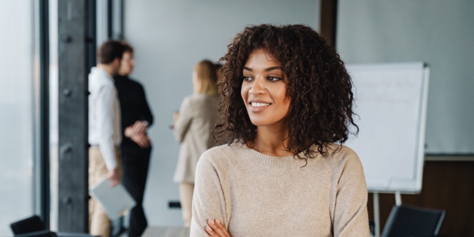 Woman happily considering her career after a business meeting