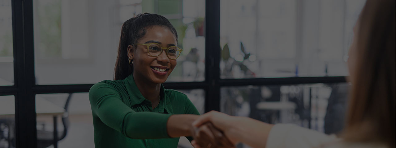 Business women shaking hands